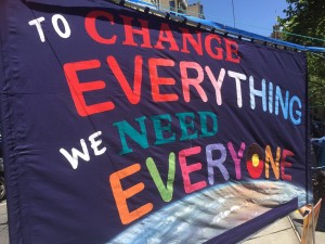 Banner reading "To change everything we need everyone"