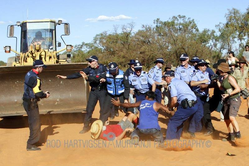 81-year old protector being protected by his son, Photos courtesy of Rod Hartvigsen - Murranji Photography